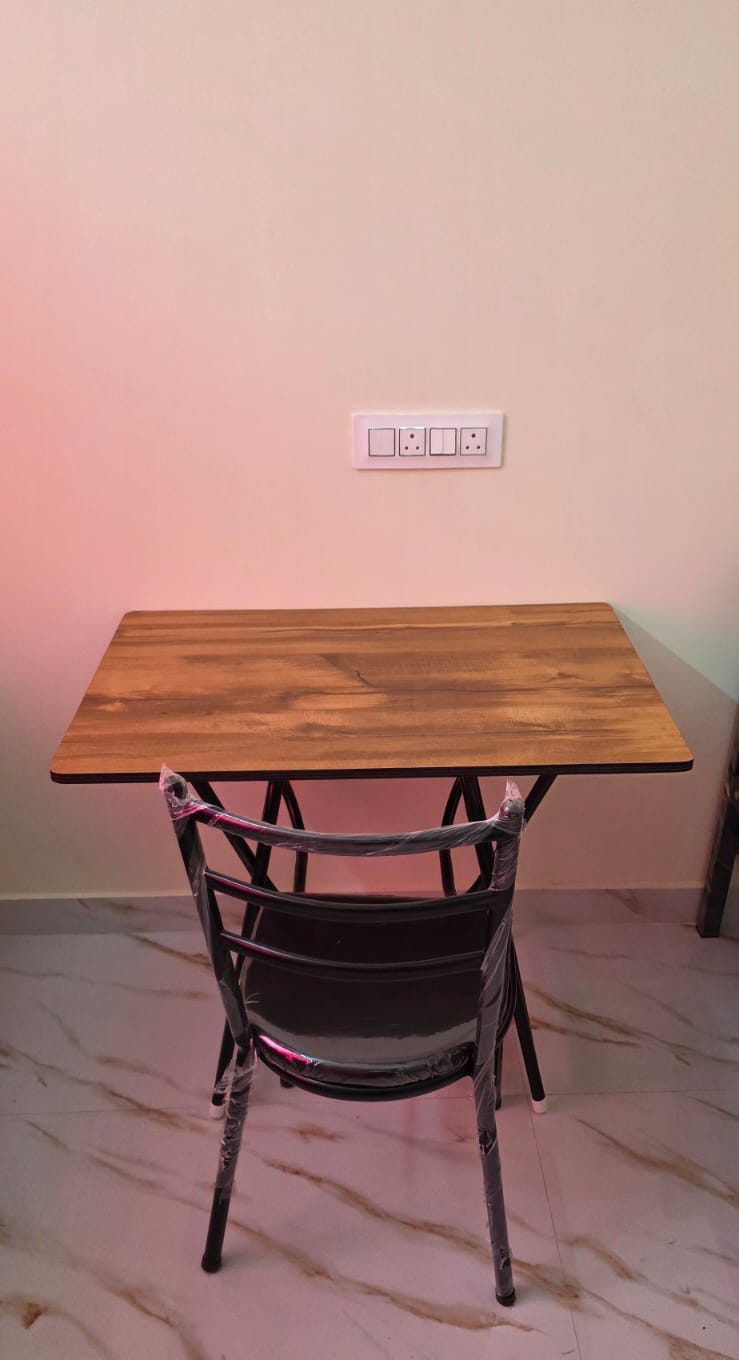 Study table and chair at NEXT Level PG for Girls, Amber